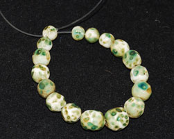 Antique green white skunk beads