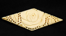 Vintage carved bone brooch